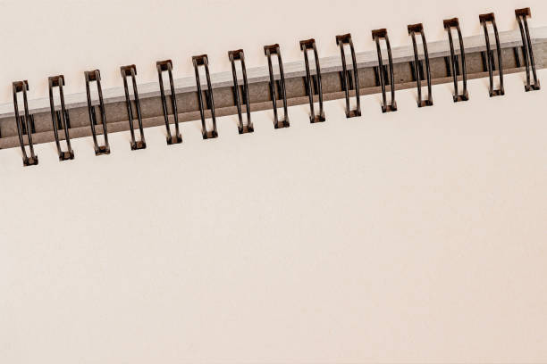 istock Minimalist spiral notebook with blank pages and metal binding. Clean and elegant background for business, education, stationery designs 2204868349