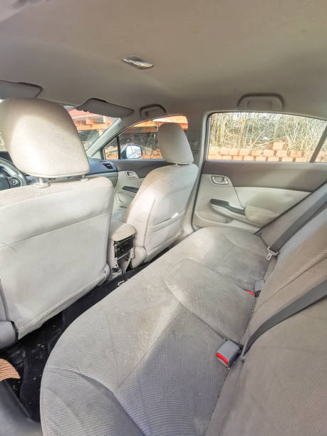 istock Spacious Car Interior with Fabric Seats and Sunlight Streaming Through Windows 2204868732