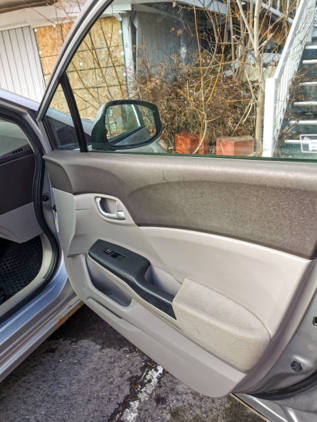 istock Open Car Door Showing Interior Panel with Fabric and Plastic Design 2204868735