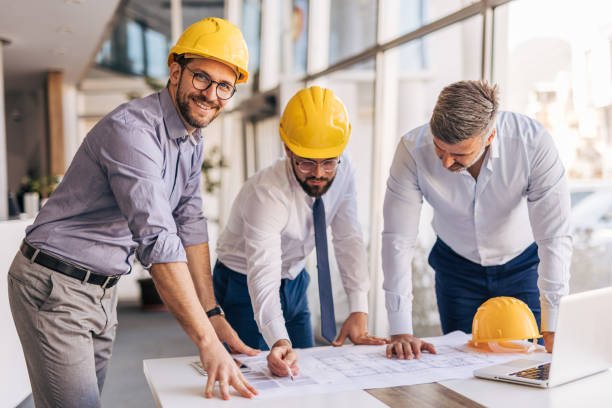istock Architects and engineers working on a building project in the office 2204869873