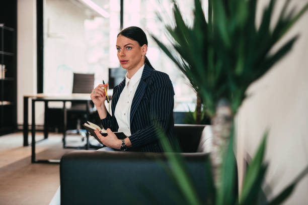 istock Businesswoman Contemplating Strategy While Sitting on Sofa 2204870199