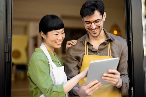 istock A pair of restaurant waiters using tablet as they're waiting for the guests 2204871941