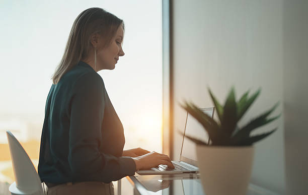 istock Woman working in the office on a laptop. 2204873065