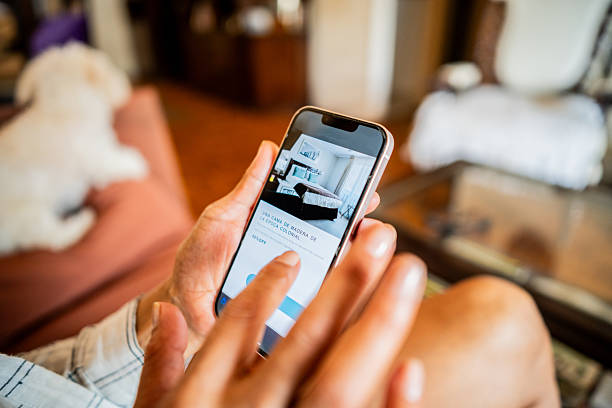 Close-up of woman using mobile phone making hotel reservation