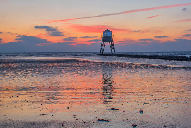 istock Dovercourt Lighthouse Harwich Orange Dawn Reflection 2204877239