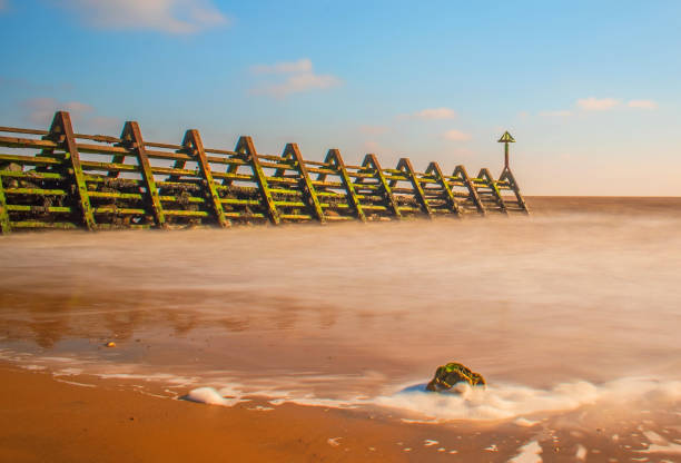 Dovercourt Harwich Beach Groynes With A Slow Shutter Sea and Cloud Effect