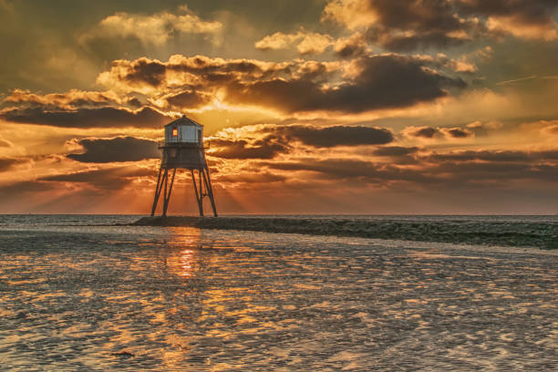Dovercourt Lighthouse Harwich Silhouetted Against A Dawn Sky