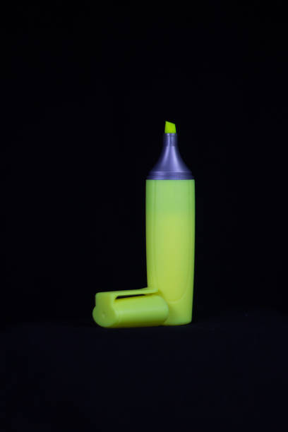 yellow highlighter pen isolated in a studio on a black background