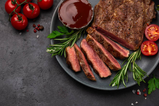 istock sliced grilled medium rare ribeye steak 2204880505
