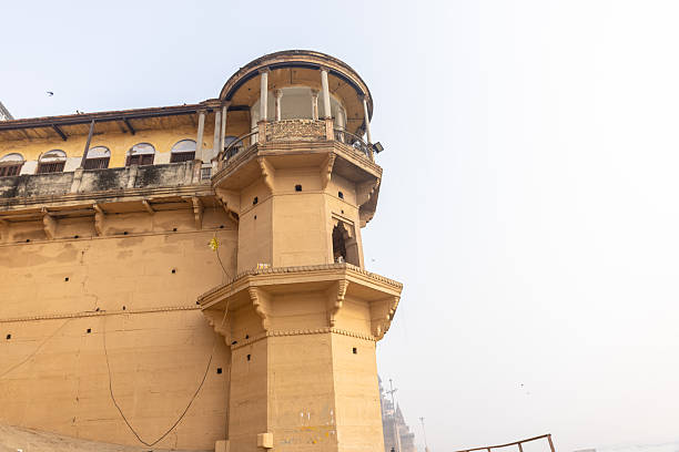 Varanasi, Uttar Pradesh, India - January 2024: Architecture view of ancient building and temples at the ghats near river ganges in varanasi.