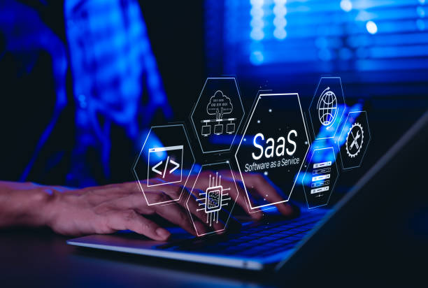 istock SaaS Software as a Service Concept. Man using laptop with futuristic interface SaaS (Software as a Service) icons, cloud computing, solutions, software development elements, modern technology platform 2204881874