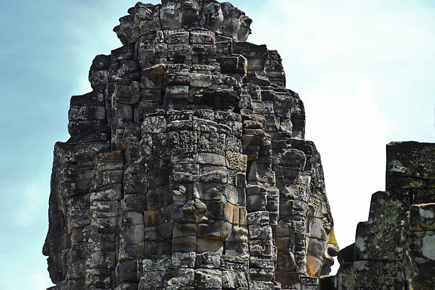 Sculptured faces of god in a Cambodian temple at Angkor Wat