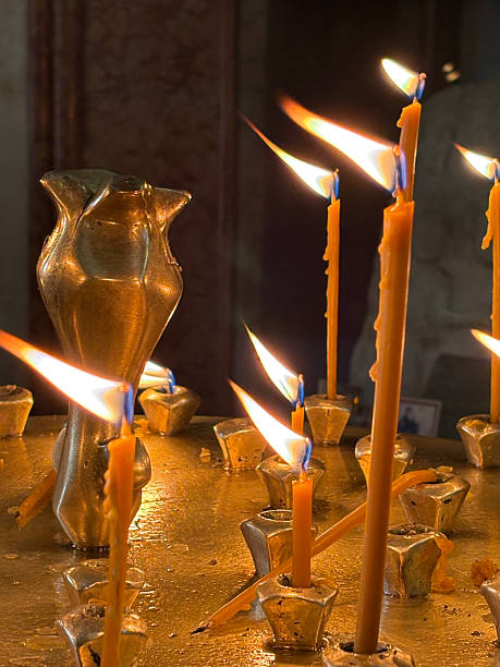 istock Candles in church 2204884441