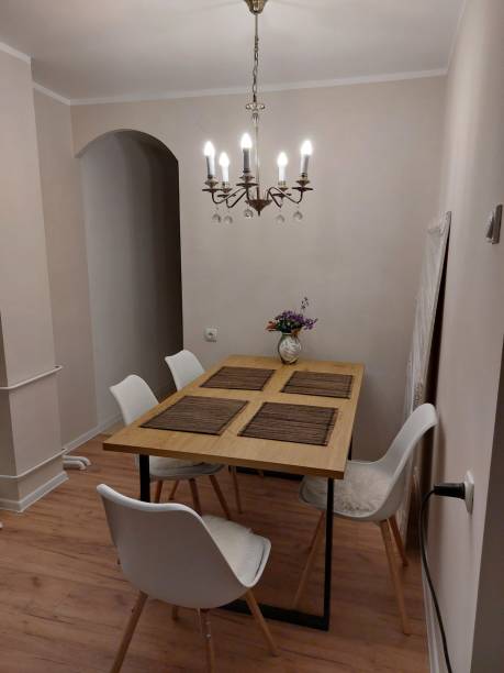 istock Luxury dining room with vintage chandelier and vase 2204889395