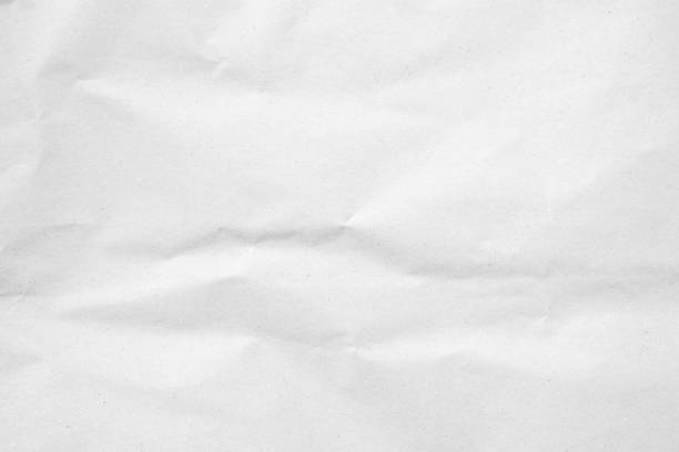 istock White recycled craft paper texture as background. Grey paper texture, Old vintage page or grunge vignette of old newspaper. Pattern rough art creased grunge letter. Hardboard with copy space for text. 2204893603