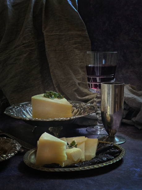 istock Parmesan with red wine on black background 2204894047