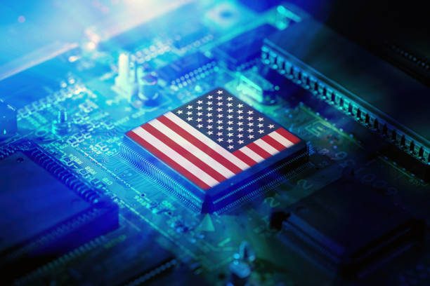 istock USA flag on a CPU processor. Chip manufacturer, GPU microchip on a motherboard. 2204894393