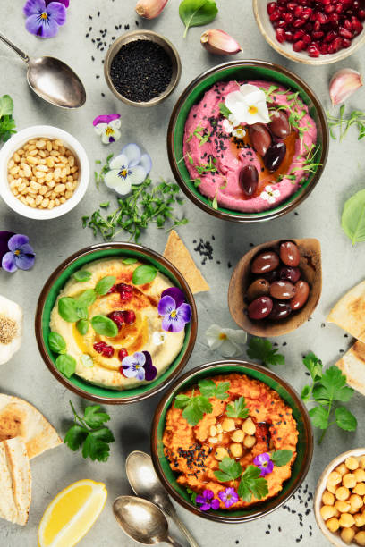istock Vibrant Hummus Trio with Fresh Ingredients and Garnishes 2204895209