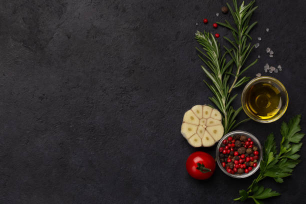 istock Food composition with olive oil, garlic, herbs and pepper 2204895613