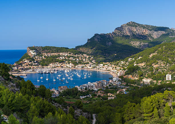 istock Port de Soller is beautiful harbor located coast Mallorca, framed by rugged mountains and crystal clear waters Mediterranean Sea. It favorite destination for tourists and boaters. 2204895698