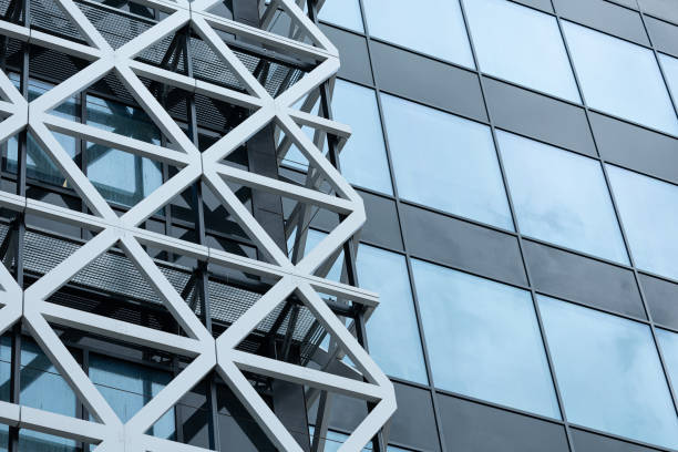 istock Modern Business Building with Glass Facade with Metal Triangles in Luminescent Elegance 2204896183