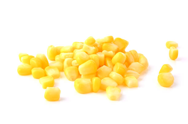 Heap of sweet corn seeds isolated on white background