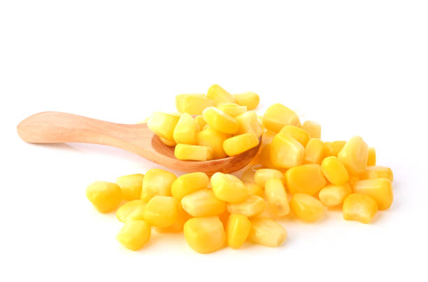 istock sweet corn seeds in wood spoon on white background 2204896979