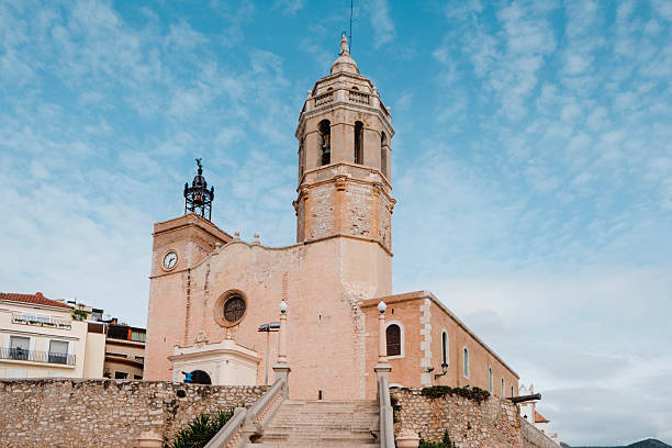 a view of Sant Bartomeu i Santa Tecla Church in Sitges, Spain, built on top of the Baluard hill, on a winter day