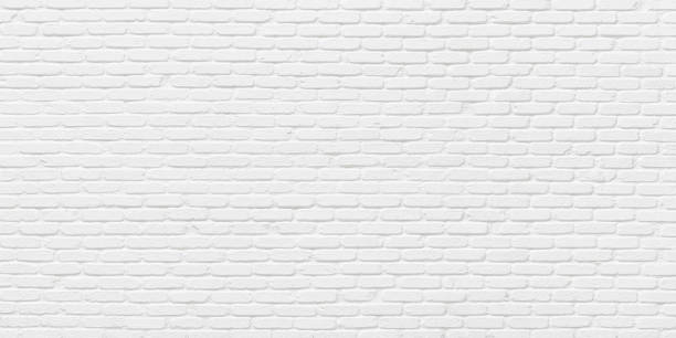 whitewashed brick wall, bright masonry texture as background - baksteen stockfoto's en -beelden