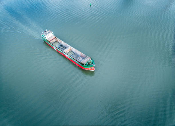 istock Aerial view of cargo ship sailing on blue sea 2204899523