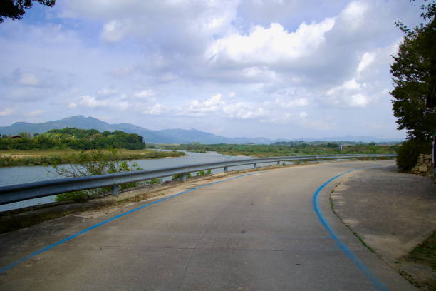 istock Seomjingang Bike Path Curving Along the River 2204900358
