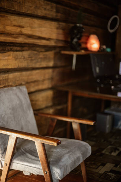 istock Vintage solid wood chair in wooden home interior. 2204901102