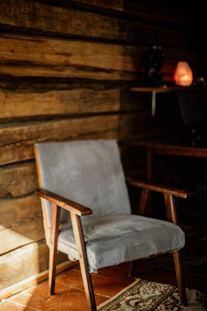 istock Vintage solid wood chair in wooden home interior. 2204901104