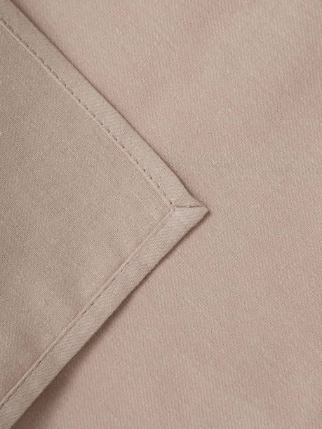 istock Beige napkin close-up. High-quality fabric and tailoring. 2204902971