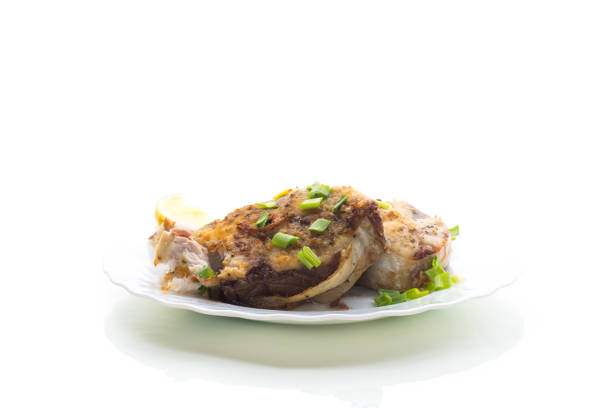 Gourmet dinner with juicy fish, isolated on white background.