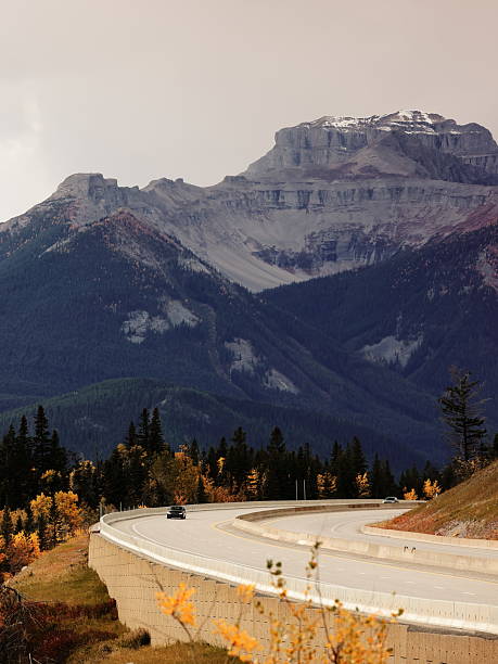 istock Trans-Canada Highway curve beneath mounts -back to front- Bourgeau and Little Bourgeau seen from Vermilion Lakes Viewpoint. Banff-Alberta-Canada-040 2204904351