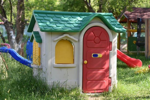 istock children's playhouse standing on the grass in a park 2204904542