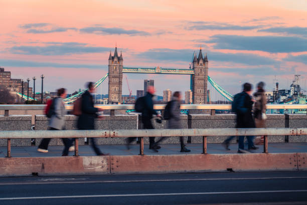 istock Tourists walking on tower bridge during sunset in london, england 2204909280