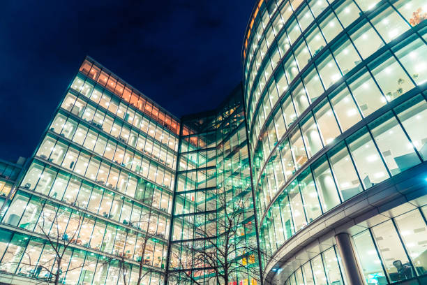 istock Modern office buildings lighting up london's financial district at night 2204909372