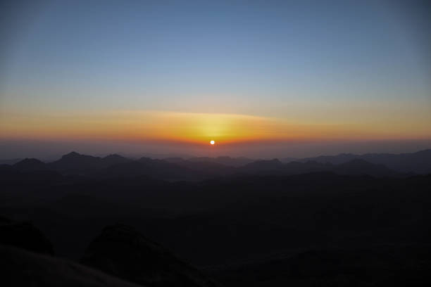 istock Beautiful orange sunrise in a rocky landscape 2204909430
