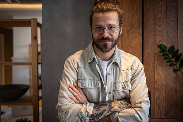 istock Confident young store manager posing with crossed arms 2204909484