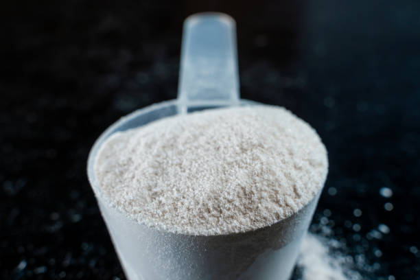 istock White powder in a scoop on a dark surface close-up 2204909664