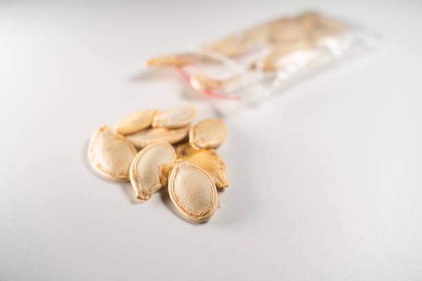 Zucchini seeds close-up on a white background.