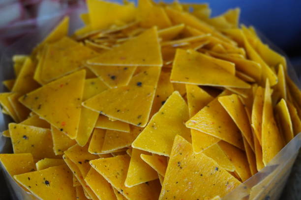istock Tortilla chips, also known as corn chips or nachos which are a popular snack food made from corn tortillas that are cut into triangles and then fried or baked 2204911311