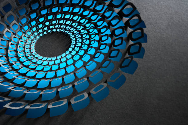 A captivating abstract paper art composition featuring precisely cut blue and black layers arranged in a circular vortex design. The intricate geometric pattern creates a sense of movement and depth, enhanced by shadows on a textured gray background.  \nNative image size: 7952 x 5304.