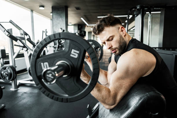 istock Muscular Man Focused on Strength Training in Gym 2204914593