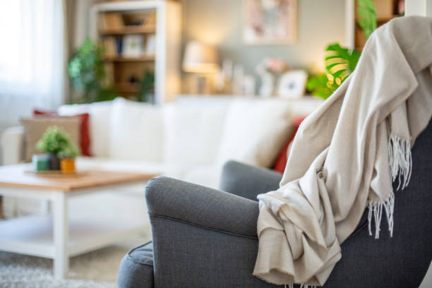istock Gray armchair and cozy blanket 2204915552