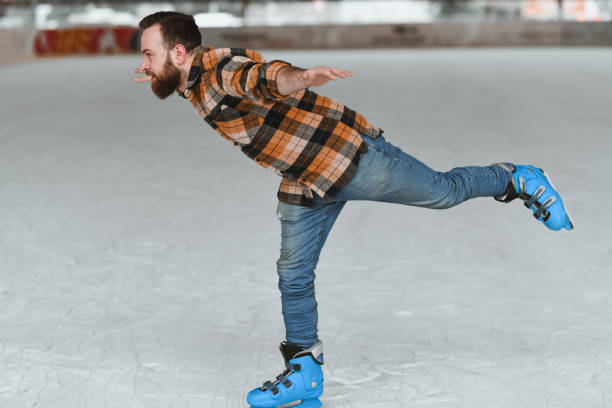 Male Ice Skater Trying Out and Mastering New Rink Techniques