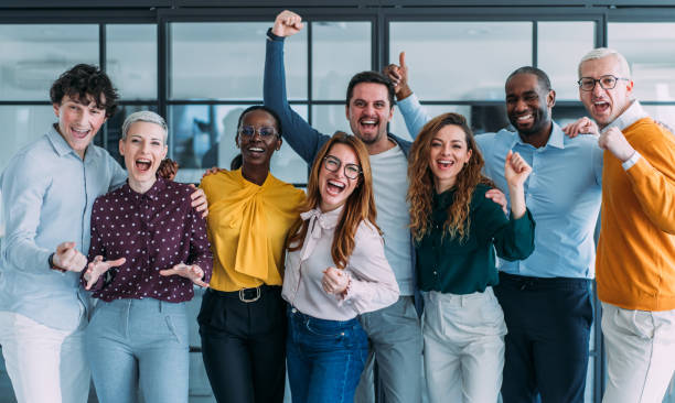 istock Cheerful entrepreneurs celebrating success in the office. 2204917933
