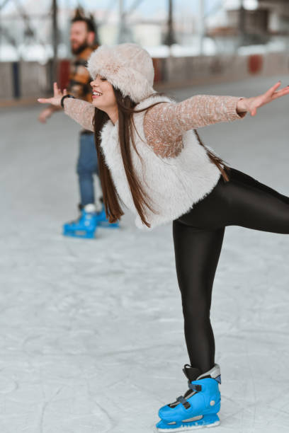 Joyful Female Smiling When Managing to Stand on One Leg While Ice Skating